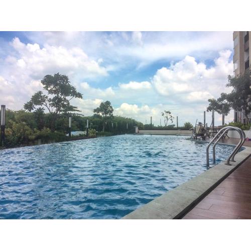 Homey Studio at The Oasis Cikarang Apartment By Travelio