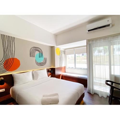 Homey Studio No Kitchen at Gateway Park LRT City Jatibening Apartment By Travelio