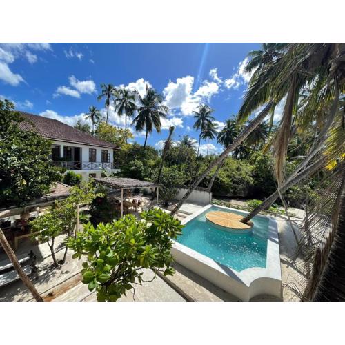 KIMA Serviced Beach House & Suites