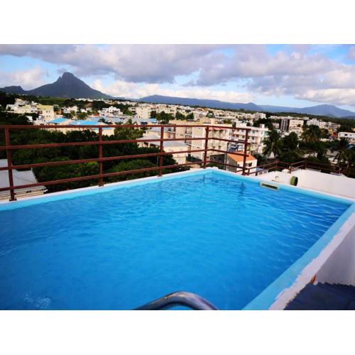 Le Vergers vue sur mer apartment privée de vacances d'été avec piscine et ascenceur proche de la plage flic en flac