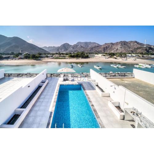 Luxurious 4-Bedroom Villa with Assistant Room and Private Pool in Al Dana Island, Fujairah by Deluxe Holiday Homes