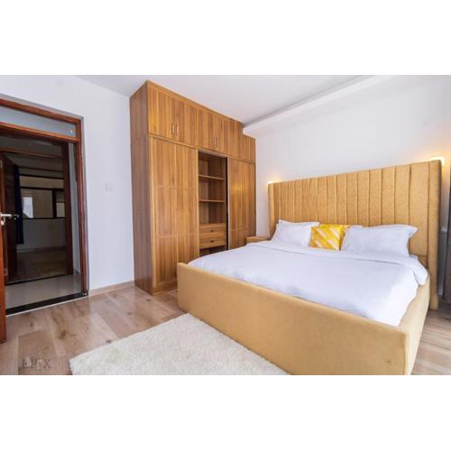 luxurious two bedroom apartment with well equipped gym ,heated swimming pool, ample parking space and a relaxing rooftop with amazing city views