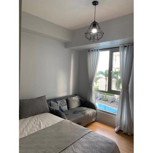 Minimalist 1 Bedroom in Alabang near Molito and ATC with WiFi & Netflix m