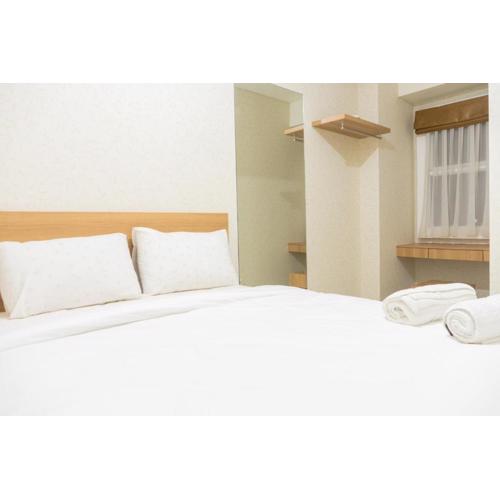 Minimalist 2BR Apartment at Parahyangan Residence By Travelio