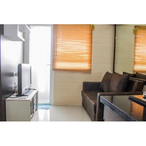Minimalist 2BR Green Pramuka City Apartment near Shopping Mall By Travelio