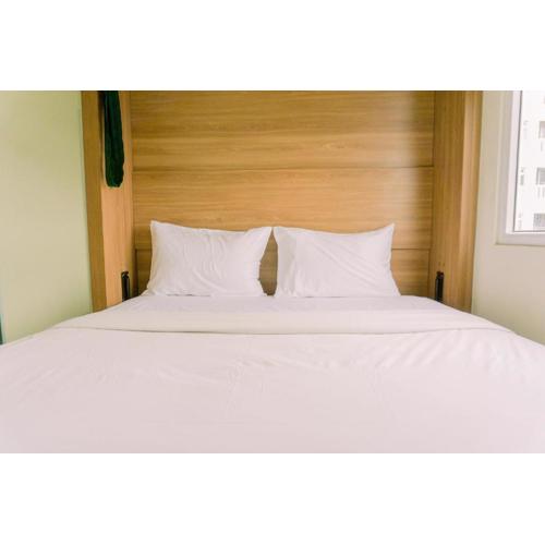 Minimalist and Best Deal 2BR Green Pramuka City Apartment By Travelio