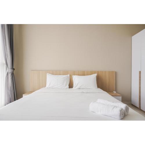 Minimalist and Comfort Living 1BR at Ciputra International Apartment By Travelio