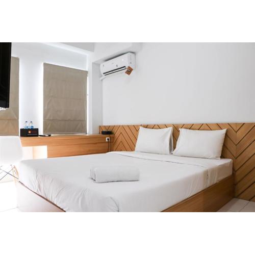 Minimalist and Cozy 1BR Patraland Urbano Apartment By Travelio