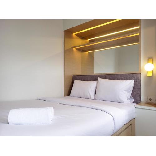 Minimalist and Cozy 2BR at La Hub City Apartment By Travelio