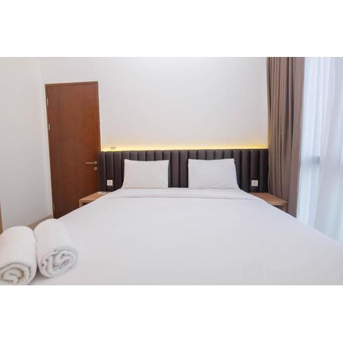 Minimalist and Homey 1BR at Ciputra World 2 Apartment By Travelio