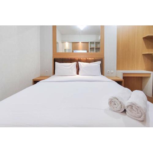 Minimalist and Homey Studio at Amartha View Apartment By Travelio