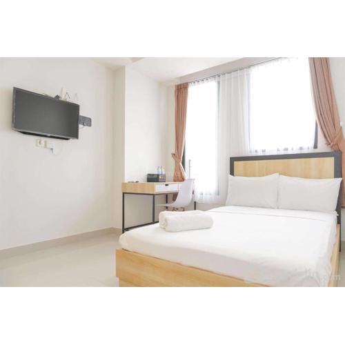 Minimalist and Homey Studio at Evenciio Margonda Apartment By Travelio