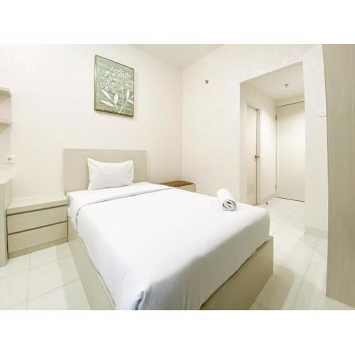 Minimalist and Homey Studio Room at Amartha View Apartment By Travelio