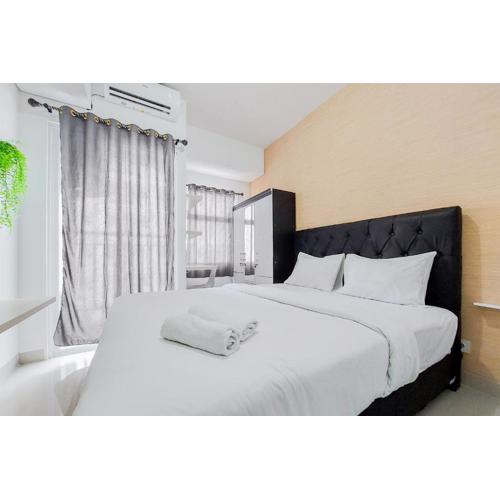 Minimalist and Homey Studio Serpong Garden Apartment By Travelio