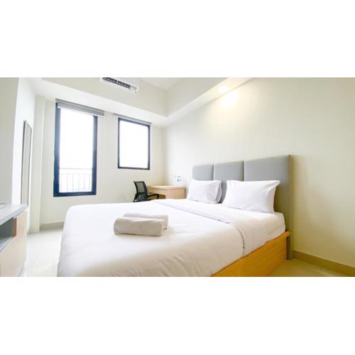 Minimalist and Nice Studio Apartment at Evenciio Margonda By Travelio