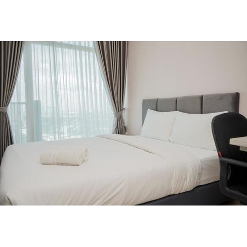 Minimalist and Nice Studio at Tree Park City Cikokol Apartment By Travelio