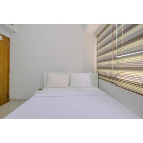 Minimalist and Posh 1BR The Oasis Cikarang Apartment By Travelio