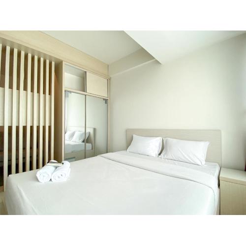 Minimalist and Strategic Studio Apartment at Grand Kamala Lagoon By Travelio