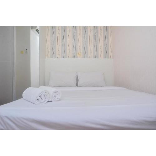 Minimalist and Warm 2BR at Bassura City Apartment By Travelio