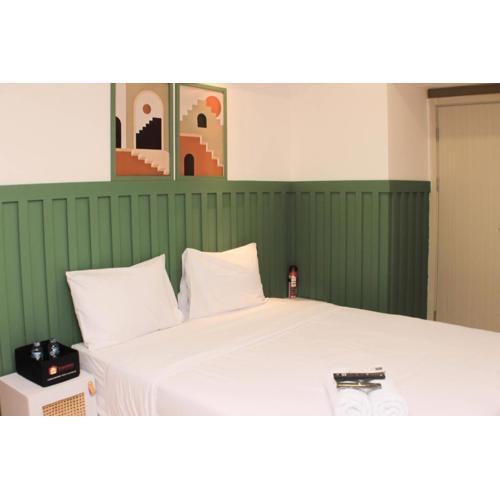 Minimalist Design Studio at Meikarta Apartment By Travelio