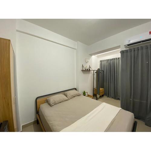 Minimalist room at The Nest Apartment by Popobella Near Puri Indah West Jakarta