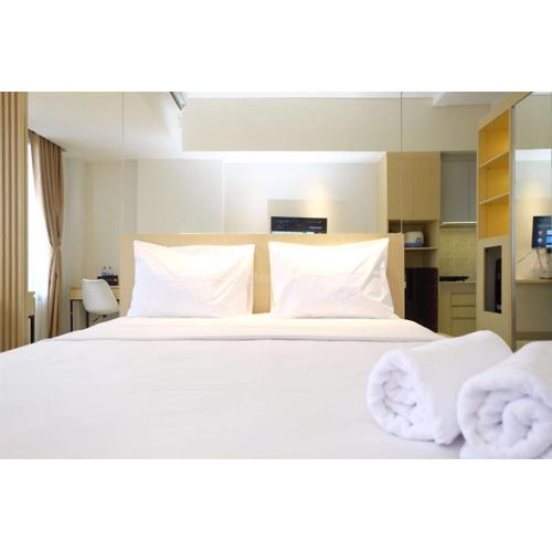 Minimalist Studio at Evenciio Margonda Apartment By Travelio