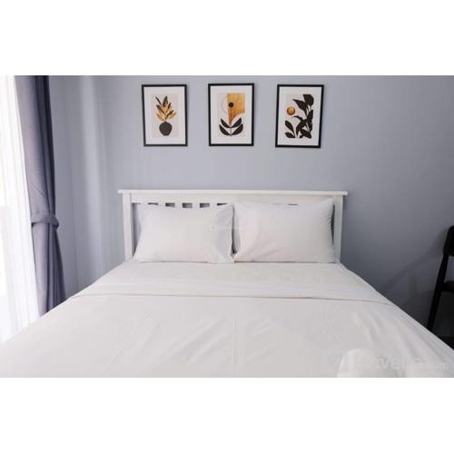 Minimalist Studio at Grand Asia Afrika Apartment By Travelio