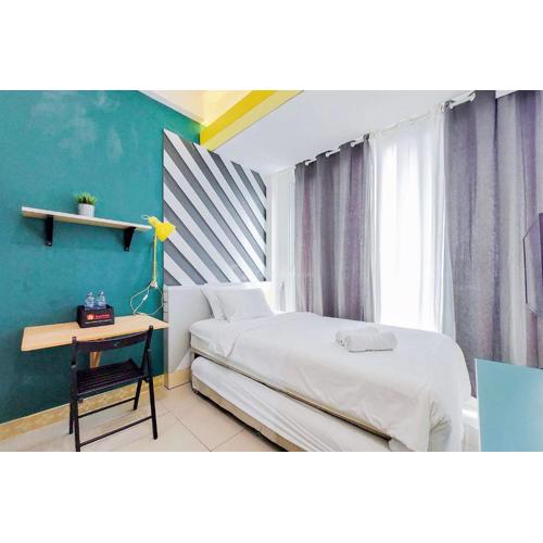 Minimalist Studio at Tree Park City BSD Apartment By Travelio