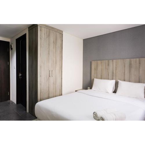 Minimalist Studio Room at Bintaro Icon Apartment By Travelio
