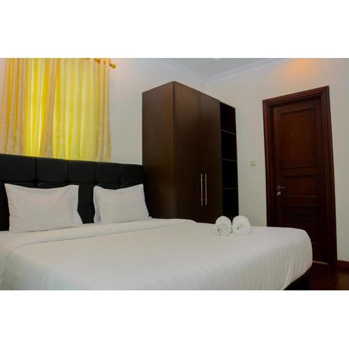 Modern 2BR at The Belleza Apartment By Travelio