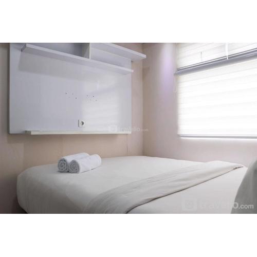 Modern 2BR Green Pramuka City Apartment near Shopping Center By Travelio