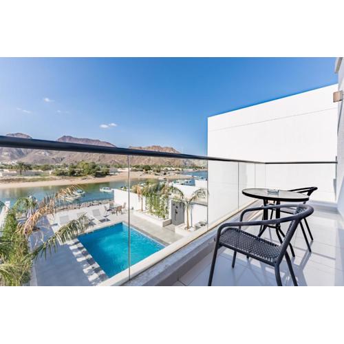 Modern 3BR with Mountain Views and Private Pool in Al Dana Island, Fujairah by Deluxe Holiday Homes