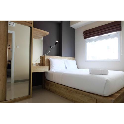 Modern and Bright 2BR Green Pramuka Apartment By Travelio