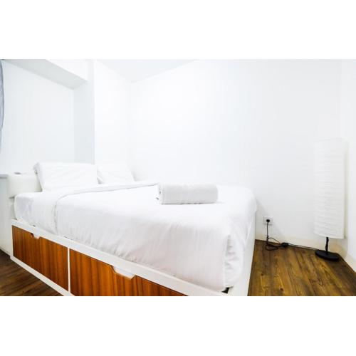 Modern and Comfy 3BR Bassura City Apartment By Travelio