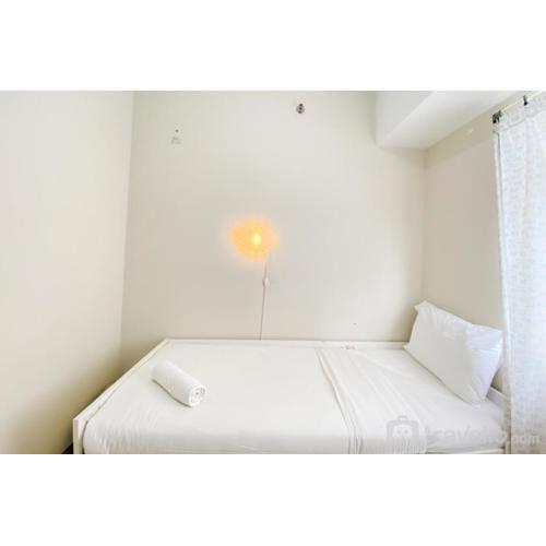 Modern and Homey 2BR at Springlake Summarecon Bekasi Apartment By Travelio