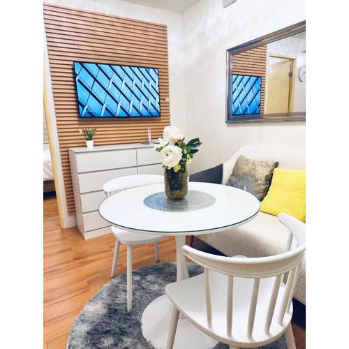 Modern Cozy 2BR Smart Lock Condo with Netflix 4K and YouTube Premium at Seawind