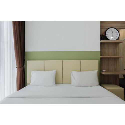 Modern Look 1BR at Brooklyn Alam Sutera Apartment By Travelio