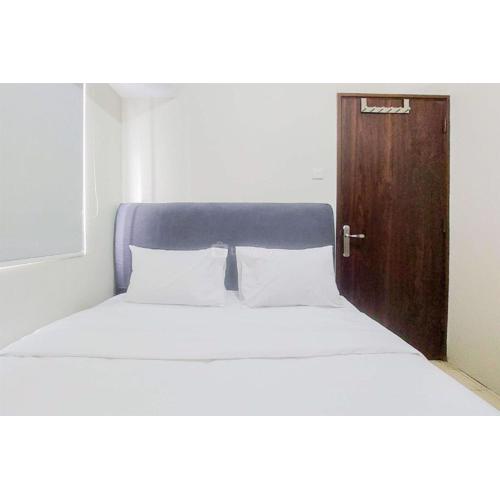 Modern Look 2BR at Serpong Greenview Apartment By Travelio