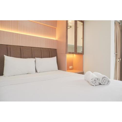 Modern Look and Homey 1BR at Gold Coast Apartment By Travelio