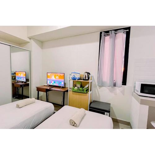 Modern Studio (No Kitchen) at Bandaraya - Tallasa City Makassar Apartment By Travelio