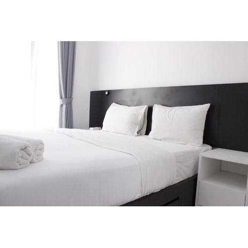 Monochrome Style Studio Room @Grand Asia Afrika Apartment By Travelio