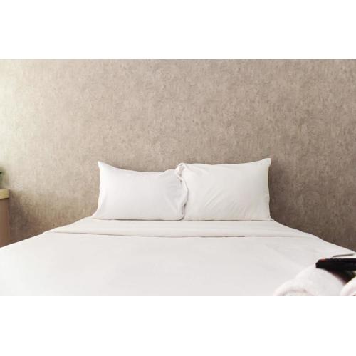 New and Cozy Studio at Patraland Urbano Apartment By Travelio