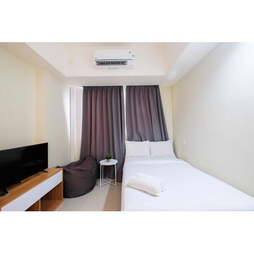 New and Nice Studio at Evenciio Margonda Apartment By Travelio