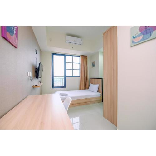 Nice 2BR at 26th Floor Evenciio Margonda Apartment By Travelio