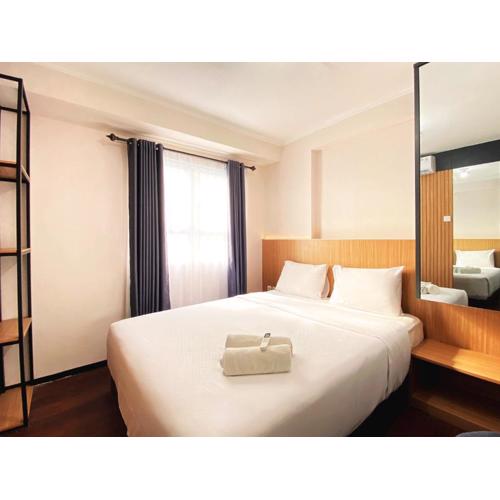 Nice 2BR at Gateway Pasteur Apartment By Travelio