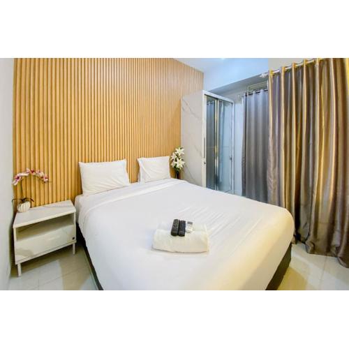 Nice and Cozy Studio at Amartha View Apartment By Travelio