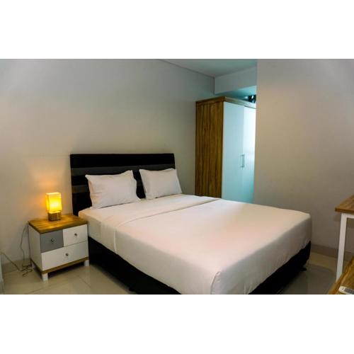 Nice and Elegant 2BR Apartment at Springhill Terrace Residence By Travelio