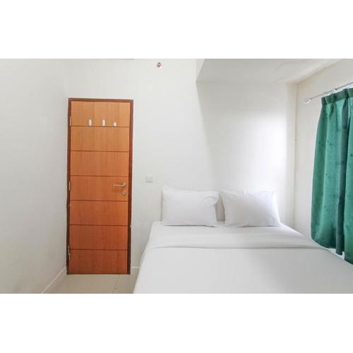 Nice and Homey 2BR at Vida View Makasar Apartment By Travelio