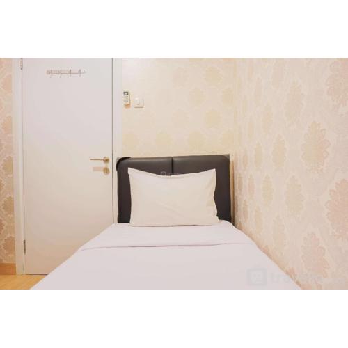 Nice and Spacious 2BR Green Pramuka City Apartment By Travelio