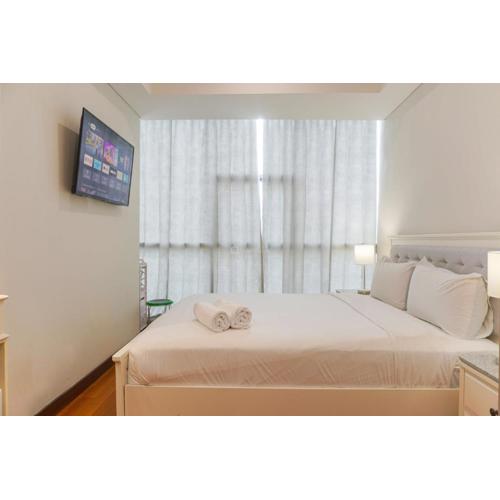 Nice and Warm 2BR Apartment Casa Grande Residence By Travelio